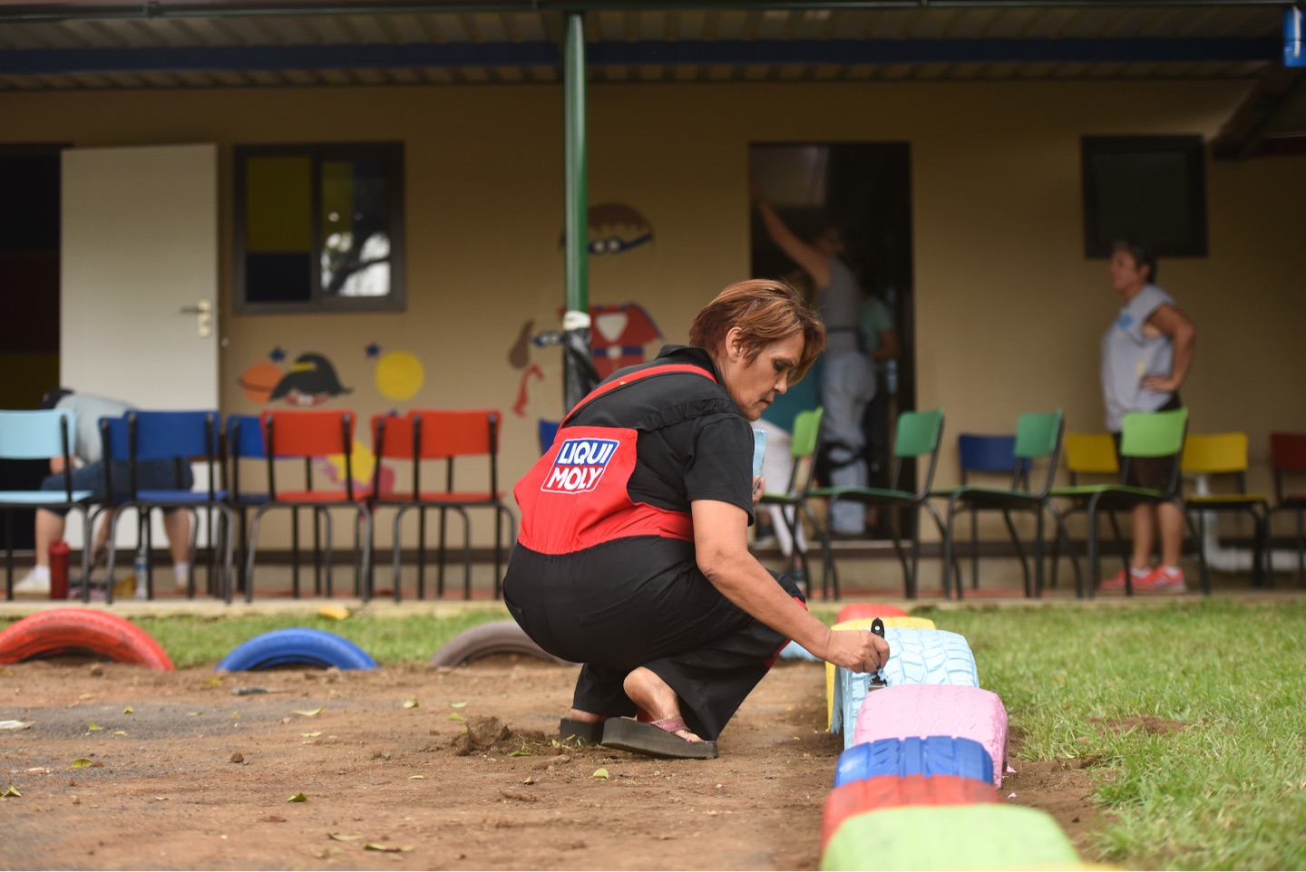 Liqui Moly team painting children's playground