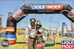 Man and woman dressed in traditional German attire at Liqui Moly sponsored event